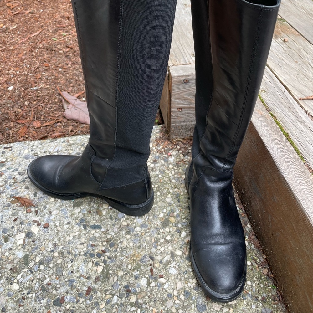 Black leather knee high boots